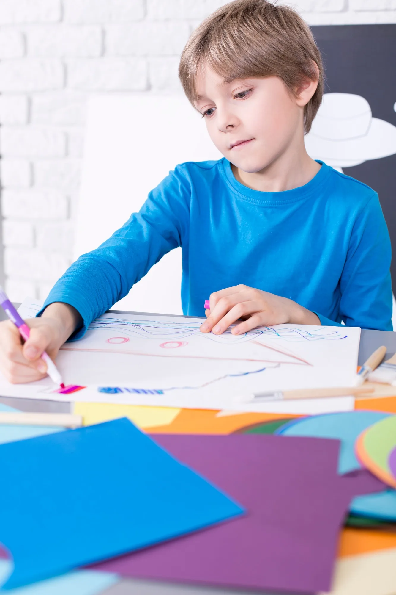 Boy coloring the picture