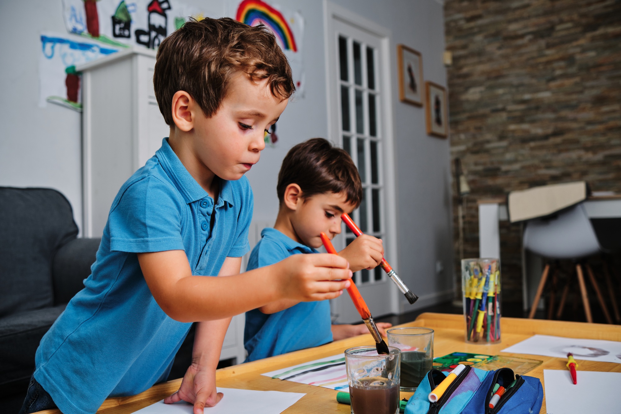 young boys playing with colors and drawing